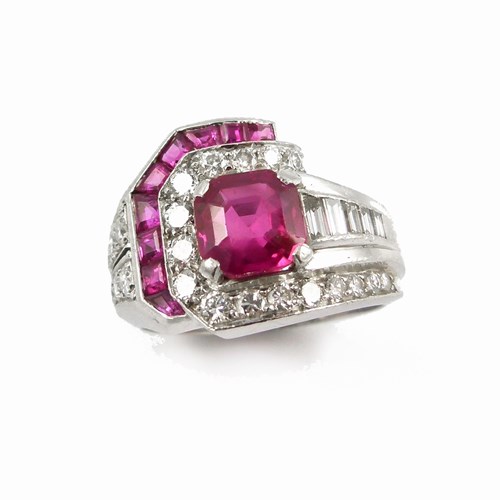 Ruby and diamond geometric cluster ring centred by an octagonal cut Burma ruby,